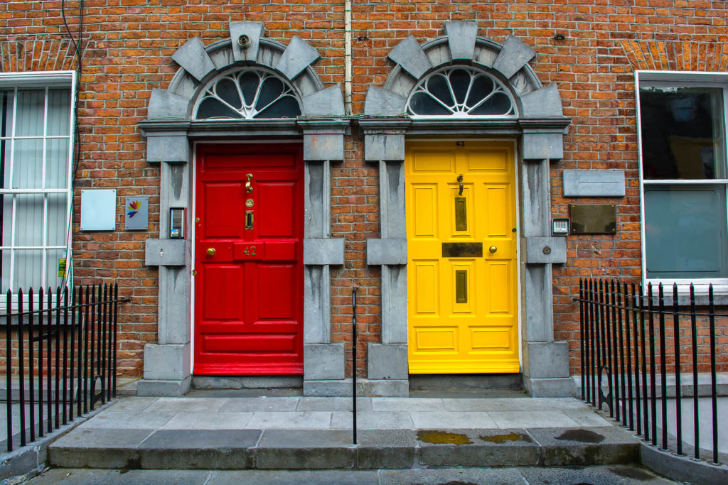 One red and one yellow apartment front door