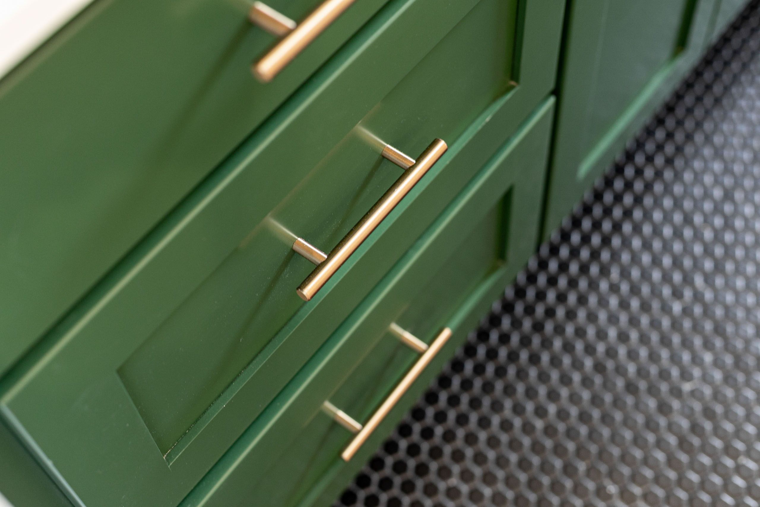 green drawers with gold handles