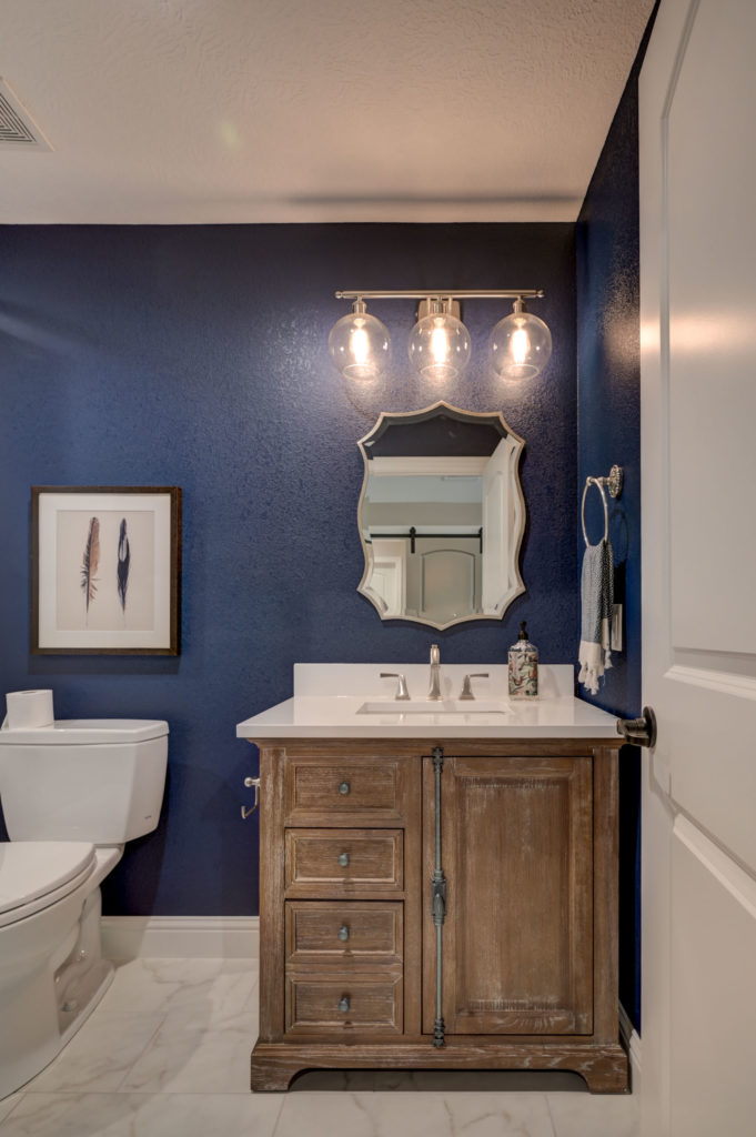bathroom with blue accent wall